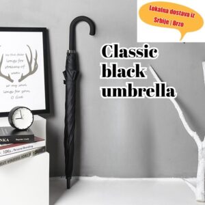 1 komad klasičnog crnog kišobrana sa dugom drškom, sa zakrivljenim ručkama u jednoj boji, pogodan za uslove. Neophodan predmet za poslovna putovanja i obavezna stvar za putovanje na posao u kišu.